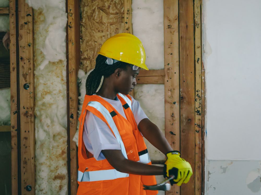 Restoration technician inspecting a property interior