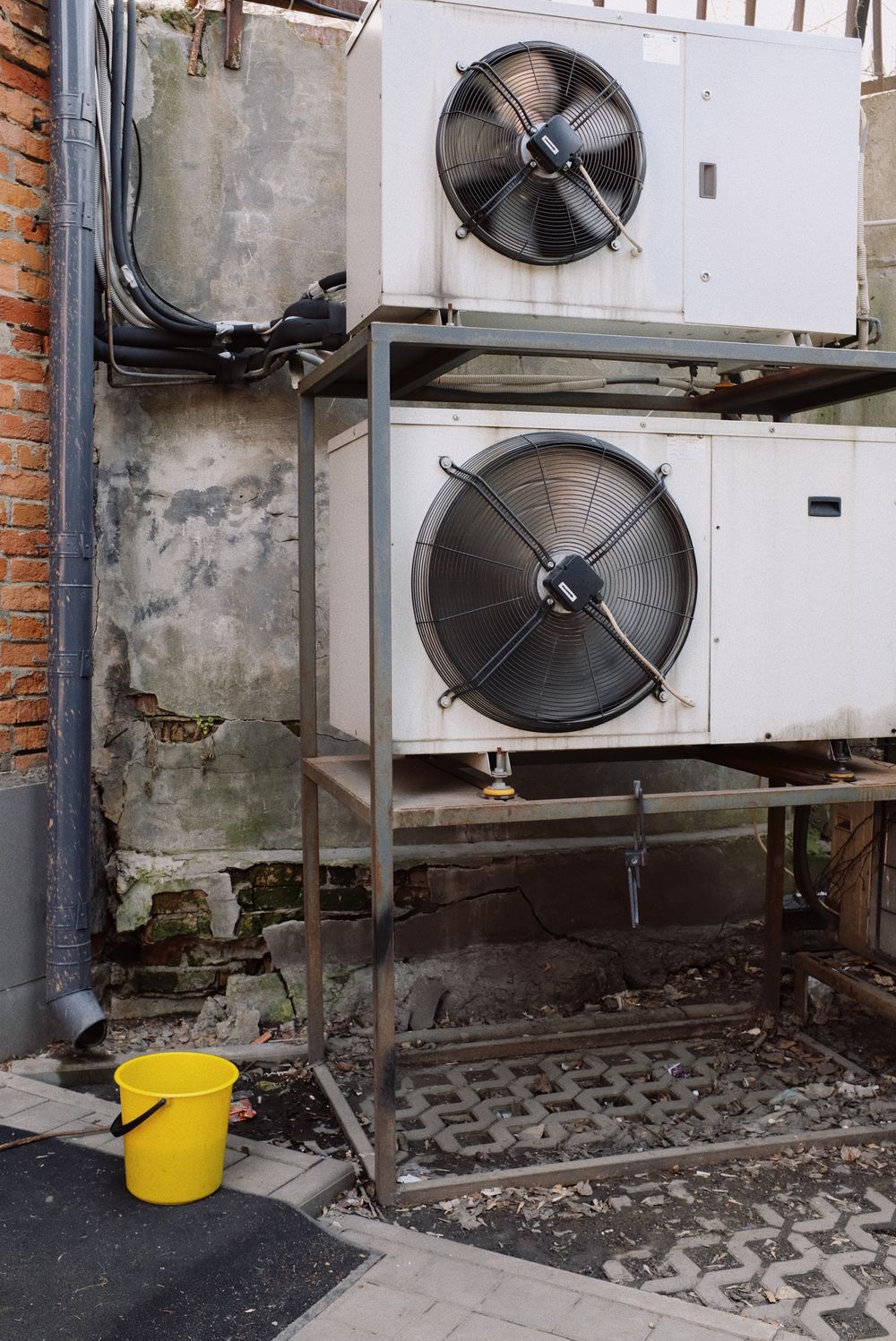 Commercial drying fans in a water-damaged utility room